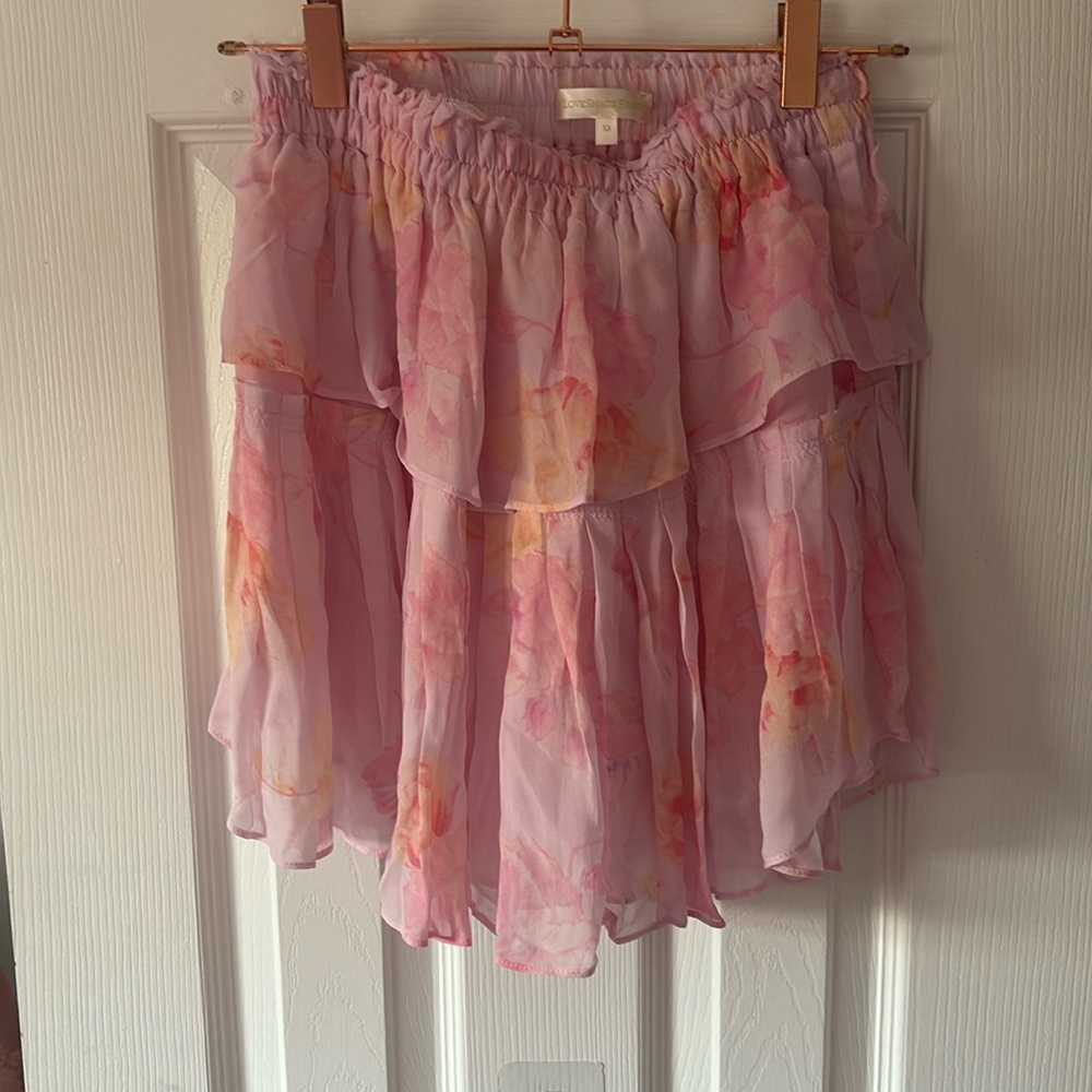LoveShackFancy’s pink floral ruffle mini skirt